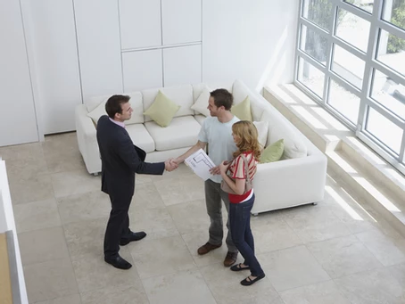 Real Estate Agent Speaking with New Clients